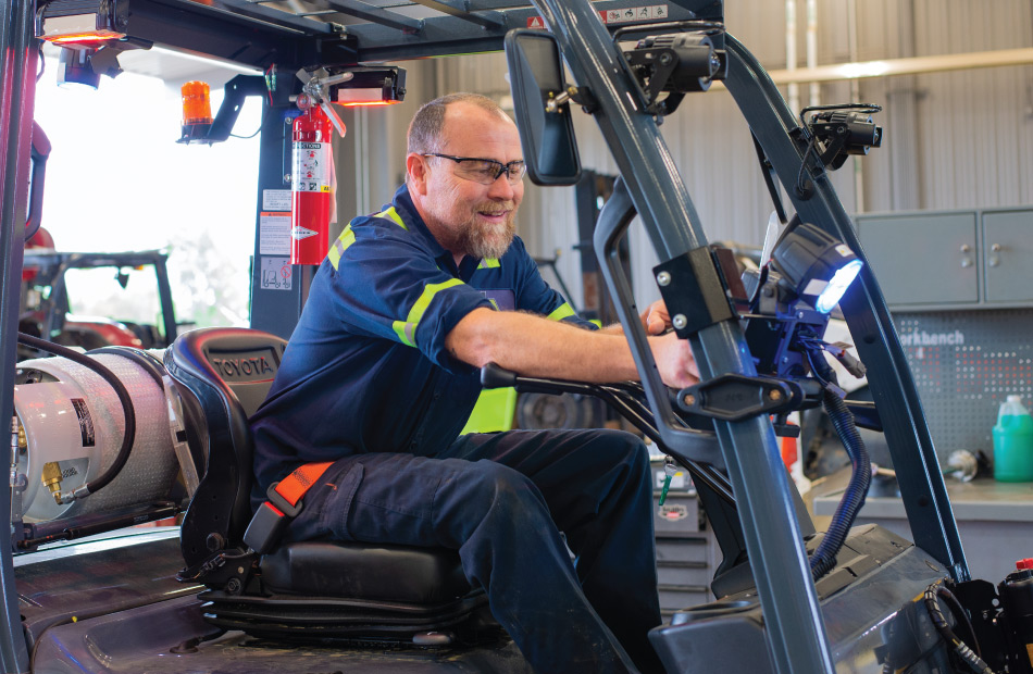 Man servicing a aerial lift.