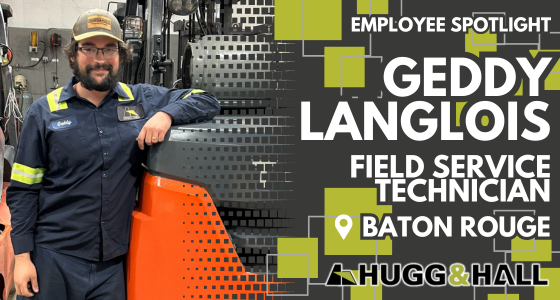 Geddy Langlois poses in front of an orange Toyota Forklift. He is an equipment mechanic in Baton Rouge, Louisiana.